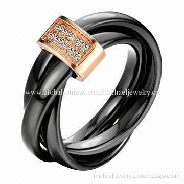 Ceramic rings with crystal and three black crossed together